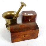 A brass pestle and mortar, a 19th century tea caddy lacking fittings, height 12.5cm, and a dome-