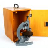 A student's microscope model L201, in wood carrying case