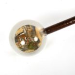 A Chinese walking stick with internally painted glass globe handle, handle diameter approx 7.5cm
