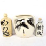 A Japanese jardiniere, 25cm, and 2 Japanese sake bottles with scripts