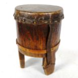 An African Tribal animal skin covered drum, height 38cm