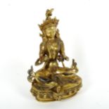 A polished bronze stone set seated Buddha, on lotus base, height 22cm