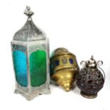 A Moroccan style lantern with green and blue glass panels, height 60cm, a brass hanging lantern, and
