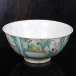 A Chinese porcelain bowl with painted figure panels and 6 character mark, 16cm across