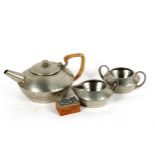 An Arts and Crafts Tudric pewter 3-piece tea set, model no. 01537, teapot height 11cm