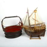 2 wooden model boats, and an Oriental painted and pierced wooden basket, height 32cm