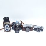 Various Vintage cameras, including Olympus OM40, Mamiya Kominar Olympus Trip 35, and Halina twin