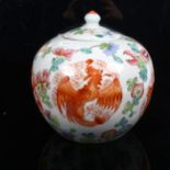 A Chinese porcelain jar and cover, with dragon and griffon decoration, height 21cm