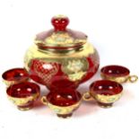 A gilded ruby glass punch bowl and 5 matching cups