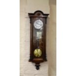 A walnut-cased Vienna regulator wall clock, case length 105cm, complete with pendulum and 2 weights
