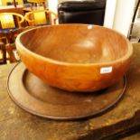 A large turned wood fruit bowl, and a turned wood shallow dish