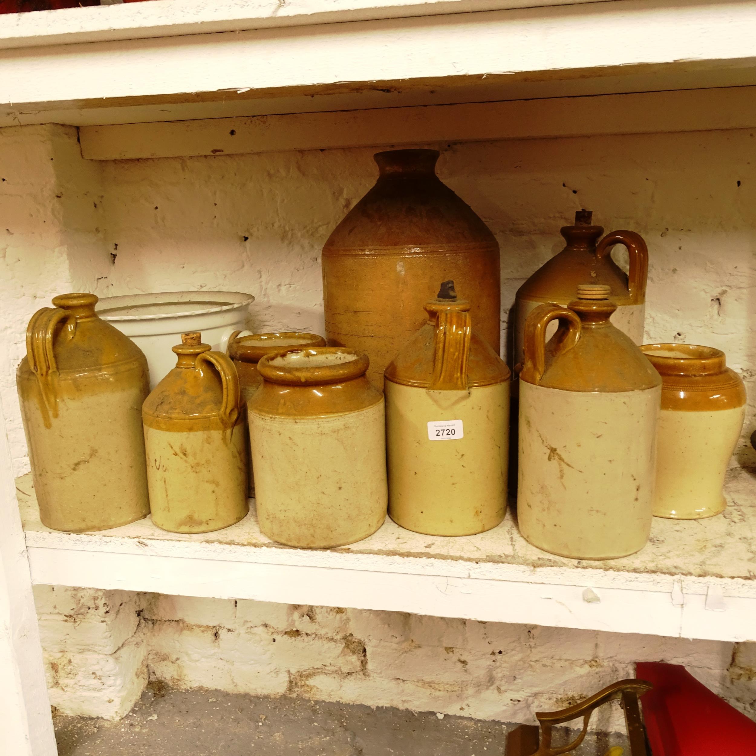 11 various salt glazed flagons and bottles, slop bucket etc