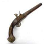 An Indian flintlock pistol with inlaid brass decoration, 43cm