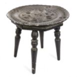 An Anglo-Indian chip carved ebonised stool, diameter 31cm, height 30cm
