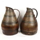 A large pair of coopered oak water flagons, height 44cm