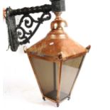 A large copper wall lantern, with cast-iron wall bracket, height 75cm