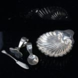 A silver shell design butter dish, a child's spoon and pusher, and a butter knife, 4.3oz