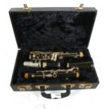 A Selmer steel ebonite 4-section clarinet, in hardshell case
