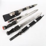 A collection of reproduction knives including dirks