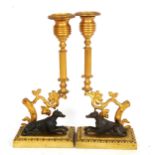 A pair of gilt-brass and bronze greyhound candlesticks, height 25cm