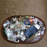 A tray of coins and banknotes