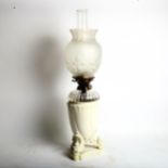 A Royal Worcester ivory porcelain oil lamp, model no. 1576, with Hinks's duplex no. 2 burner, with