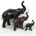 A graduated set of 3 African leather-covered elephant figures, largest height 50cm