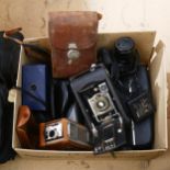 A box camera, a movie camera, Canon cine camera, Nikon Coolpix etc