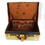 TIFFANY & CO - a Vintage black leather vanity case, with brass mounts and canvas cover, width 46cm