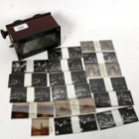 A Vintage stereo viewer, and black and white glass slides