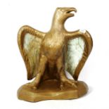 A large gold painted pottery eagle sculpture, unsigned, height 57cm, width 50cm