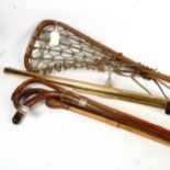 A replica rifle, a lacrosse stick, and 4 walking sticks including silver-mounted