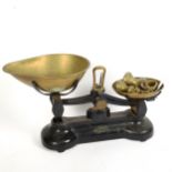 A pair of Libra cast-iron balance scales with weights, base length 32cm