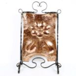 An Art Nouveau copper and wrought-iron floral fire screen, height 74cm