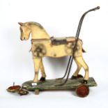 A child's Vintage painted wood push-along horse toy, length 60cm