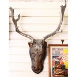 A Folk Art pine deer's head with antlers, overall height 85cm