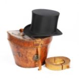 A Vintage black top hat, by Bates of London, in Victorian brown leather hat box by J W Allen