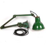 A retro mid-century green industrial factory desk-top machinist's anglepoise lamp, with white enamel