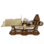 A Victorian set of cast-iron and brass balance scales, with graduated set of weights, length 54cm