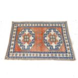 A cream ground Afghan design rug, 173cm x 127cm