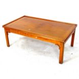 A modern yew wood coffee table, L107cm, H41cm, D63cm