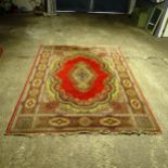 A large red ground Persian design carpet, 360cm x 272cm (Viewing by appointment only as this rug