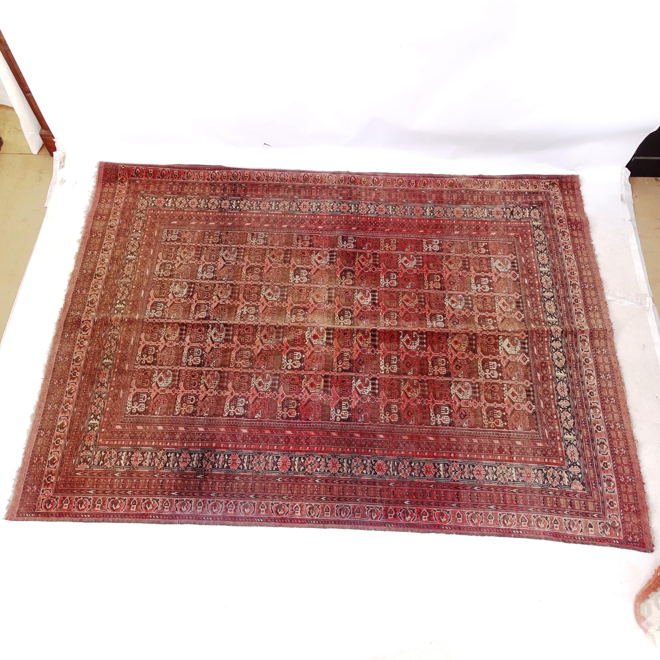 An Antique red ground Hamadan rug, 230cm x 170cm