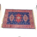 A blue ground Chiraz design Belgian synthetic rug, 200cm x 140cm