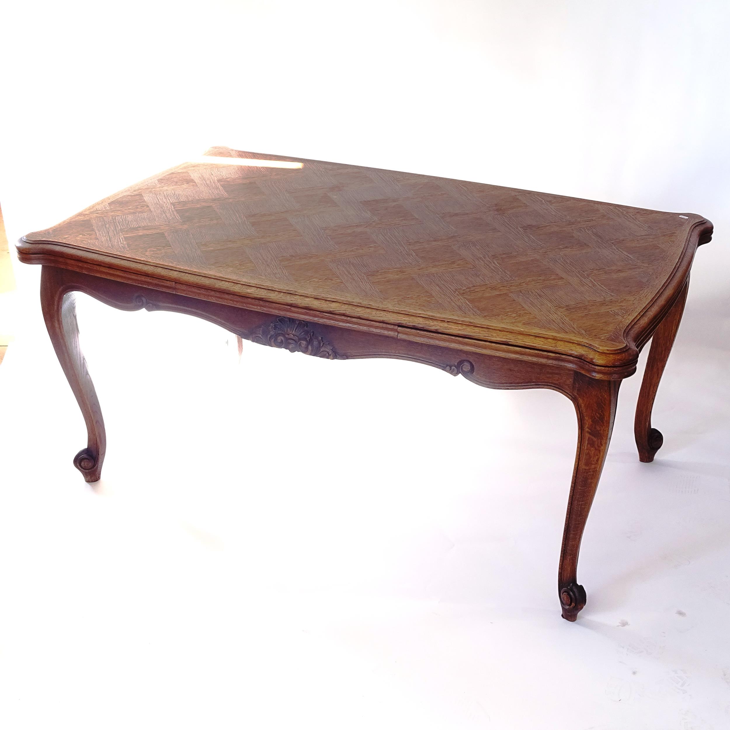 A French oak parquetry-top draw leaf table, L160cm extending to 260cm, H75cm, D97cm