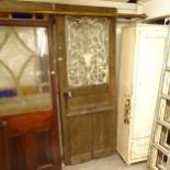 *WITHDRAWN* A panelled oak-framed door, with an inset glass and applied scrolled wrought-iron panel,