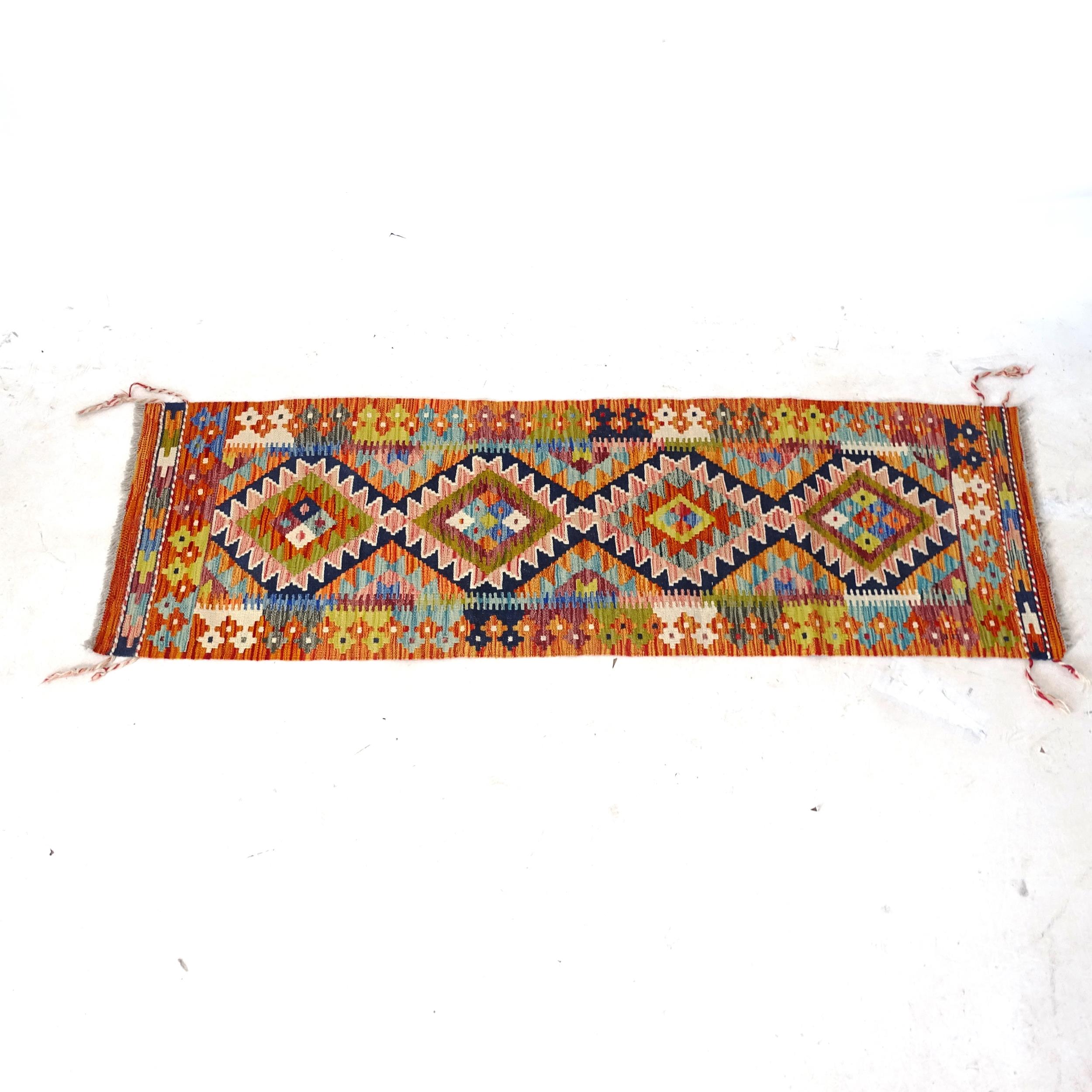 A Chobi Kilim runner, 197cm x 64cm