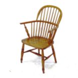 An oak spindle-back bow-arm chair