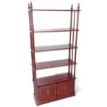 An Oriental hardwood 5-tier open bookcase, with brass inlaid cupboard doors (A/F), W91cm, H200cm,