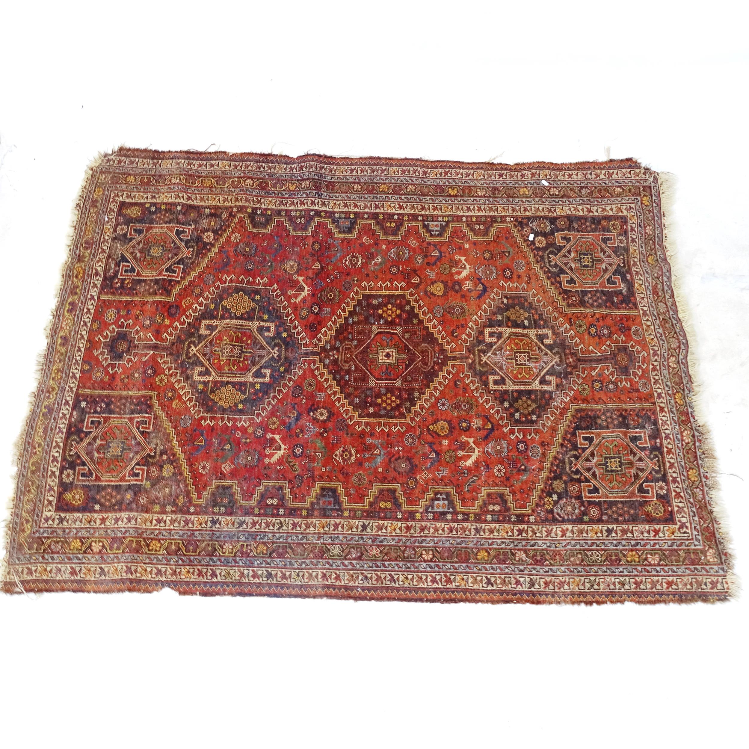 An Antique red ground Persian rug, with 5 symmetrical panel border and lozenge, 200cm x 150cm - Image 2 of 2